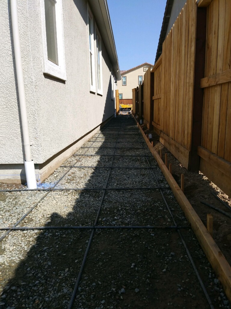 The photo shows the finished concrete and masonry work in Los Gatos from Cupertino.